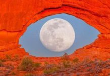 Image of Full Moon Through a Rock Formation Looks Like a Giant Eye