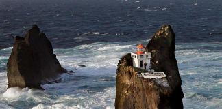 Incredible location for a lighthouse perched on a rock in Iceland’s wild surf